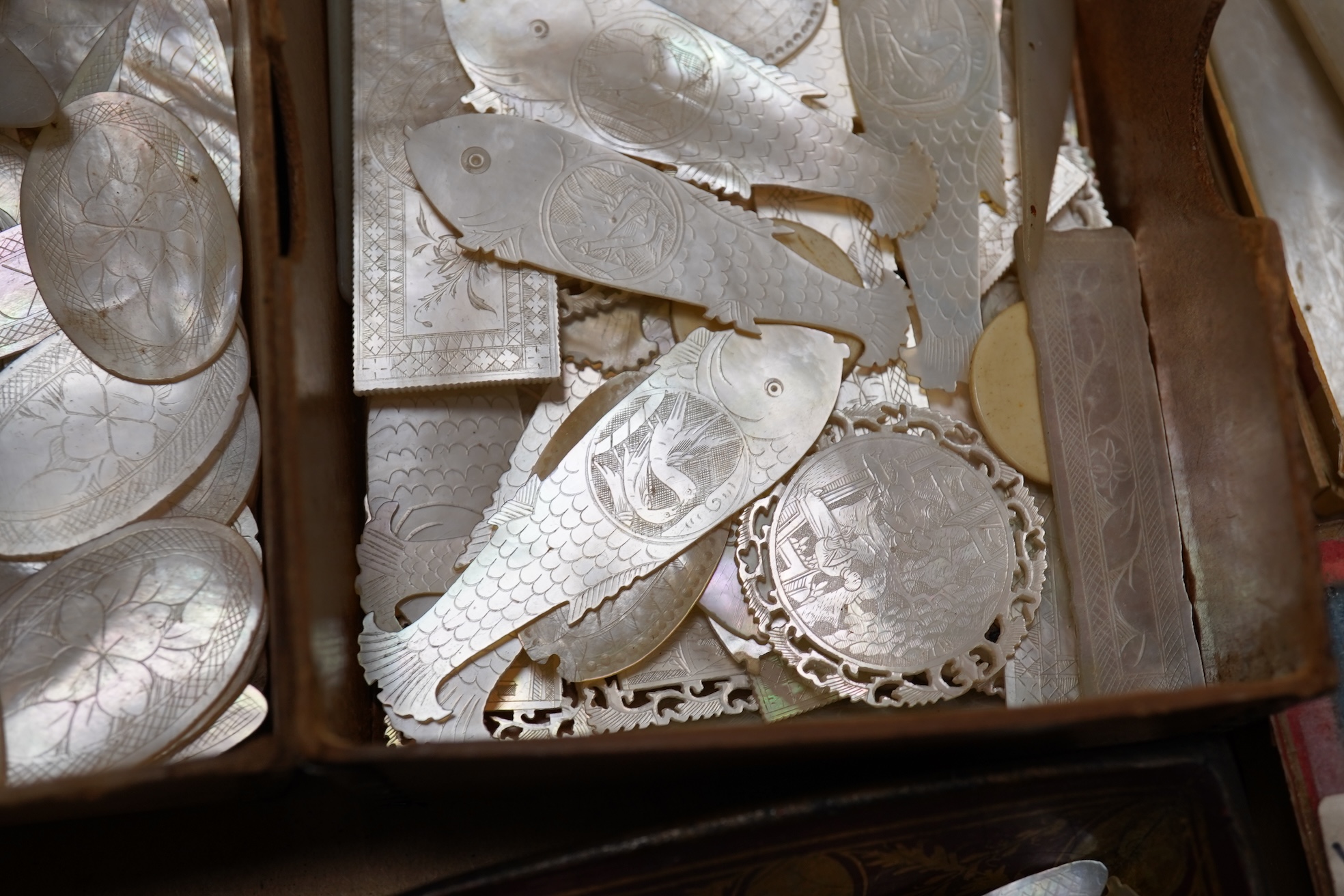 A group of 19th century Chinese mother of pearl gaming counters and accessories, together with a miniature silver cased compass